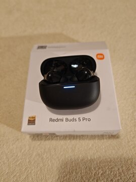 Prague,Czech Republic-April 2 2026: Redmi Buds 5 Pro wireless earbuds displayed with open charging case and retail packaging