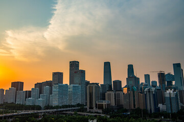 Obraz premium Sunset and blue hour over the Beijing Central Business District skyline featuring the China Zun skyscraper in Beijing, China.