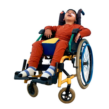 A young boy with special needs sitting in a wheelchair isolated on transparent background
