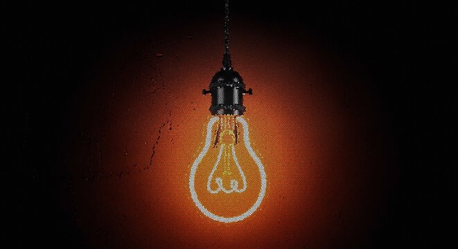 Glowing edison light bulb on dark background