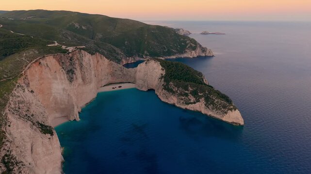 Discover the breathtaking views of Navagio Beach, or Shipwreck Beach, in Zakynthos, Greece. Marvel at the stunning cliffs and crystal-clear waters during the enchanting golden hour.