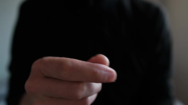Doomscrolling and smartphone overuse. Close up hand endlessly scrolling short video feed until thumb pain and digital fatigue force a break