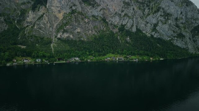   Aerial view reveal of Traunstein mountain peak from Traunsee lake, Austria