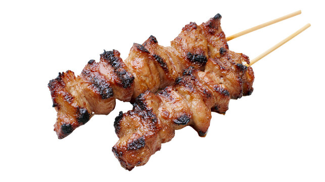 Grilled pork skewers with charred edges