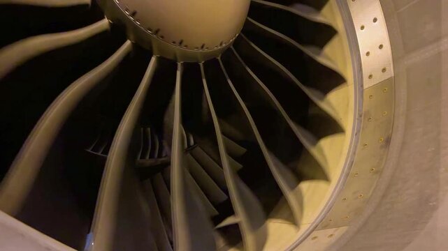 Detailed Close Up View of Jet Engine Turbofan Blades and Internal Stator Guide Vanes Illustrating Commercial Aircraft Propulsion Mechanical System