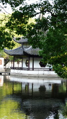 Fototapeta premium The classical Suzhou garden view with the old buildings and summer plant on them in summer 