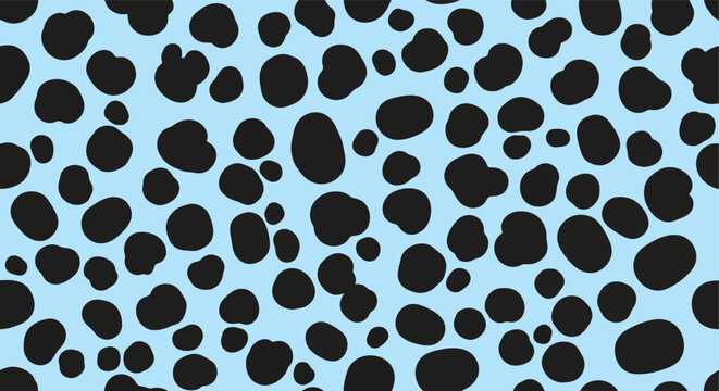 Seamless dalmatian spot pattern with black organic shapes on a light blue background.
