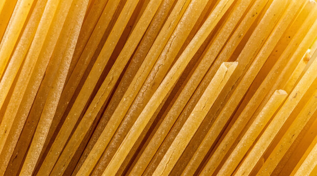 Close up texture of dry yellow spaghetti pasta strands