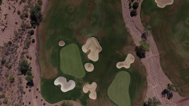 A HD aerial view of a desert golf course located in southeastern Arizona in the summer.