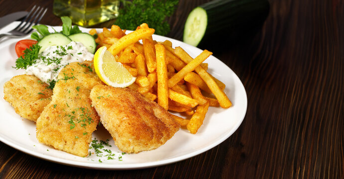 Fried Fish with French Fries - Panorama with wooden Background