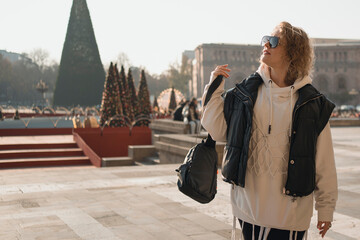 Obraz premium Adult fashion outfit woman at walk in Yerevan during Christmas holidays