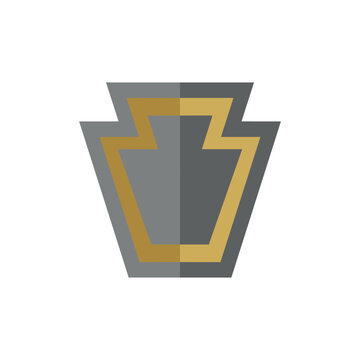 Gray and gold keystone shape architectural symbol.