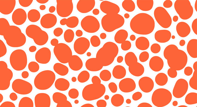Seamless pattern of organic orange blob shapes on a white background for textile design.