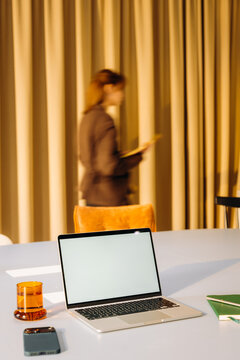 A laptop with a white screen on a desk