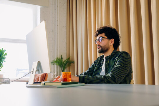 A man using a computer in the office