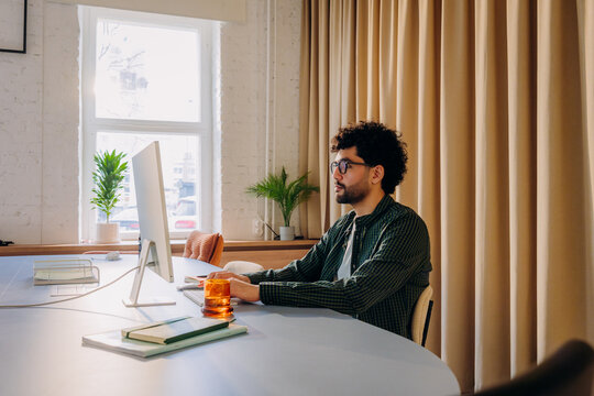 A man using a computer in the office