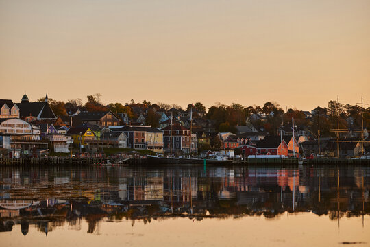 Sunset view of Lunenburg waterfront with reflections on the water