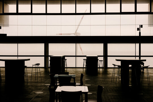 Airport waiting area shows organized rows of seats
