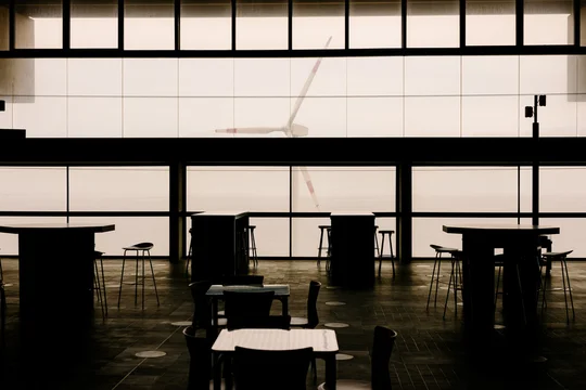 Airport waiting area shows organized rows of seats
