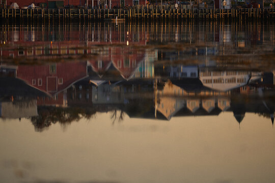 Sunset view of Lunenburg waterfront with reflections on the water