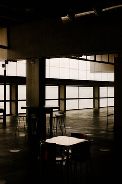 Vacant waiting space inside airport features aligned seats