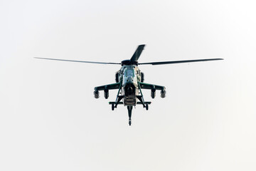 Fototapeta premium Military helicopter flying on isolated white background