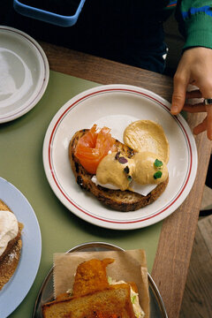 Analog close-up from above of a plate of eggs Benedict with salmon