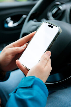 Driver holding phone with mock up screen