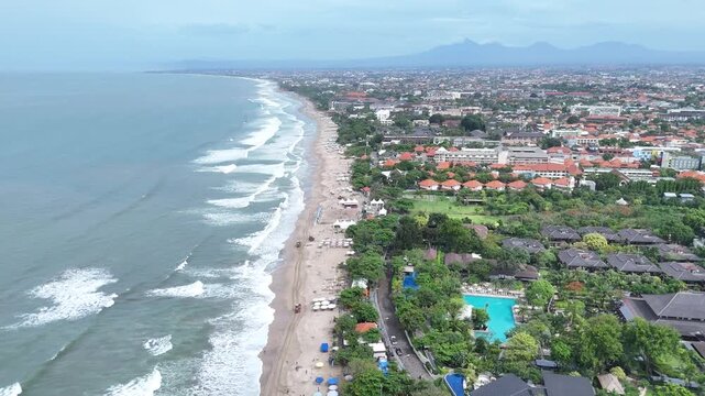 Cinematic Drone Shot of Legian Beach Coastline and Coast Town Bali