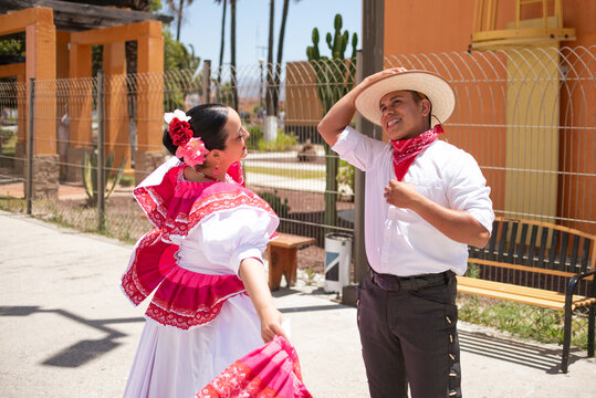 Mexican couple dancing traditional folk dance