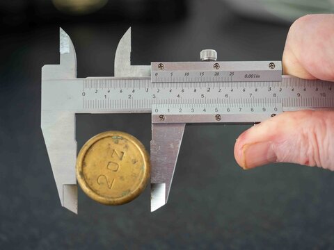 analogue vernier caliper precision engineering measurement tool  in action