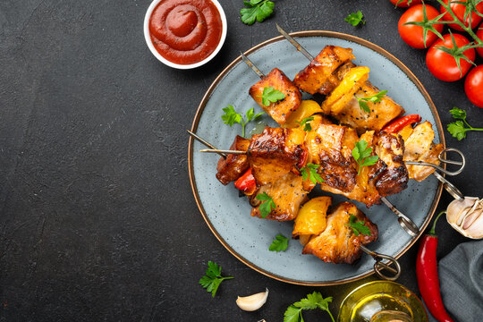 Grilled shish kebab or meat skewers with vegetables.
