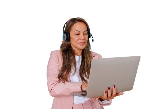 Woman wearing a pink suit and headset with a microphone, using a laptop for virtual meetings, assistance, or e-learning