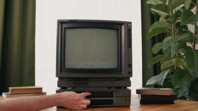 Retro TV, vintage television In a nostalgic setup, a retro TV displays grain on screen, scary halloween night device good for chroma key and green screen.