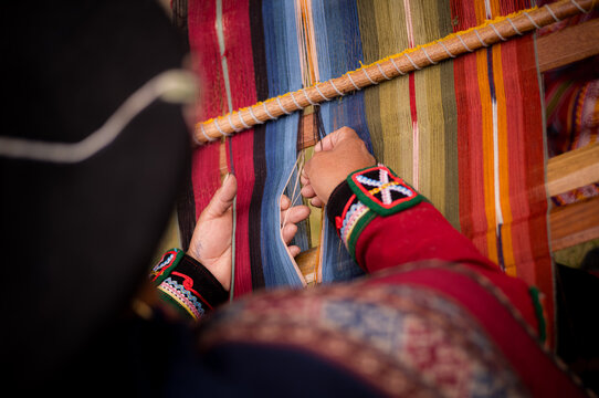 Details of women weaving in the Sacred Valley near Cusco in Peru.