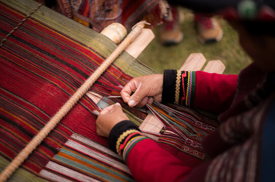 Details of women weaving in the Sacred Valley near Cusco in Peru.