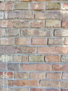 Vintage red and beige brick wall texture background, old weathered brickwork
