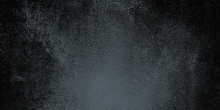 Dark grungy gray background with textured surface and subtle gradient effect for design and artistic projects