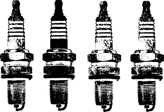 Four vintage spark plugs arranged in a row with detailed worn metal texture