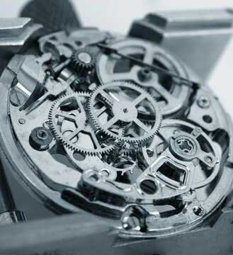 Macro photography concept of internal mechanism and vintage gears of a mechanical watch under repair