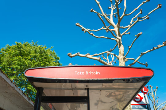 Abstract view of a London bus stop and shelter showing the destination being the famous Tate Britain exhibition which is nearby.