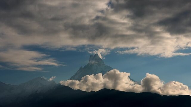 Wide shot of Fishtail Peak Revealed by Moving Clouds | Nepal Himalayas