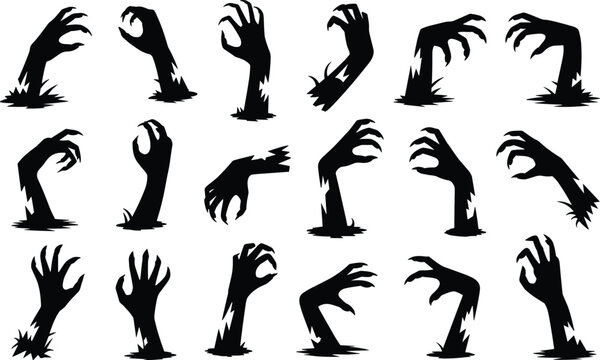 Spooky collection of undead zombie hand silhouettes reaching from the ground in an eerie graveyard for Halloween horror.