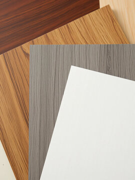 Various SPC or laminate flooring planks samples with different wood grain textures for home remodeling