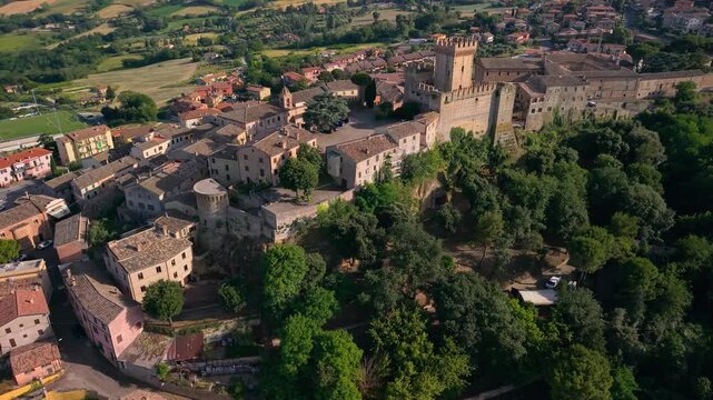 Offagna Marche one of most beautiful vilages in Italy aerial view medieval rocca fortress hilltop town and scenic rolling hills. Italian tourism cinematic drone 4k