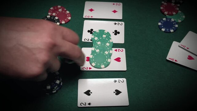 Hand placing poker chips on playing cards during a card game, showing a sequence of actions with visible cards and chips on a green felt table