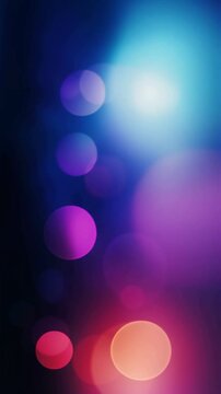 Blurred blue and pink bokeh background with soft abstract light effects, vertical video featuring dreamy colors, glowing circles and elegant atmospheric motion