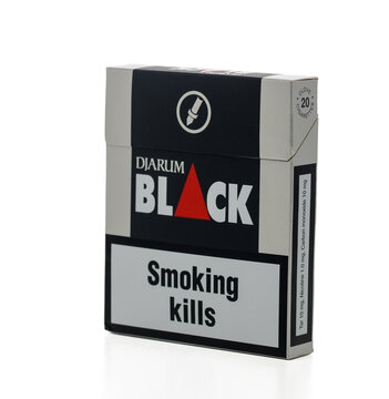 Gaziveren Cyprus -05.12.2024 Djarum Black cigarette pack sits on a clean surface with a warning about smoking risks