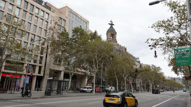 Barcelona, Spain - September 03, 2023: Passeig de Gracia in autumn in Barcelona. Spain. It one of major avenue in city. Located in Eixample district