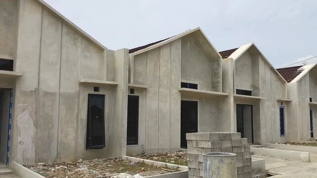 Subsidized housing that is closely arranged with the same size. Side view of subsidized housing development in Central Java, Indonesia - 06.21.2026.